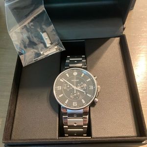 Movado Pilot Watch with 2 Year Warranty Slip included.